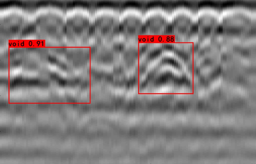 GPR image of a tunnel lining with two voids detected and boxed after rebar clutter removal